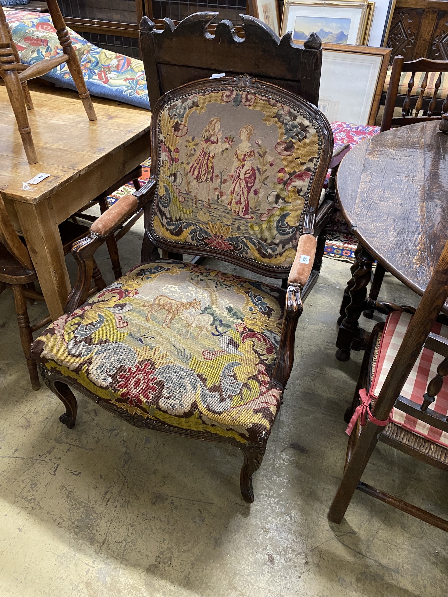 A French tapestry upholstered elbow chair, width 65cm, depth 60cm, height 93cm